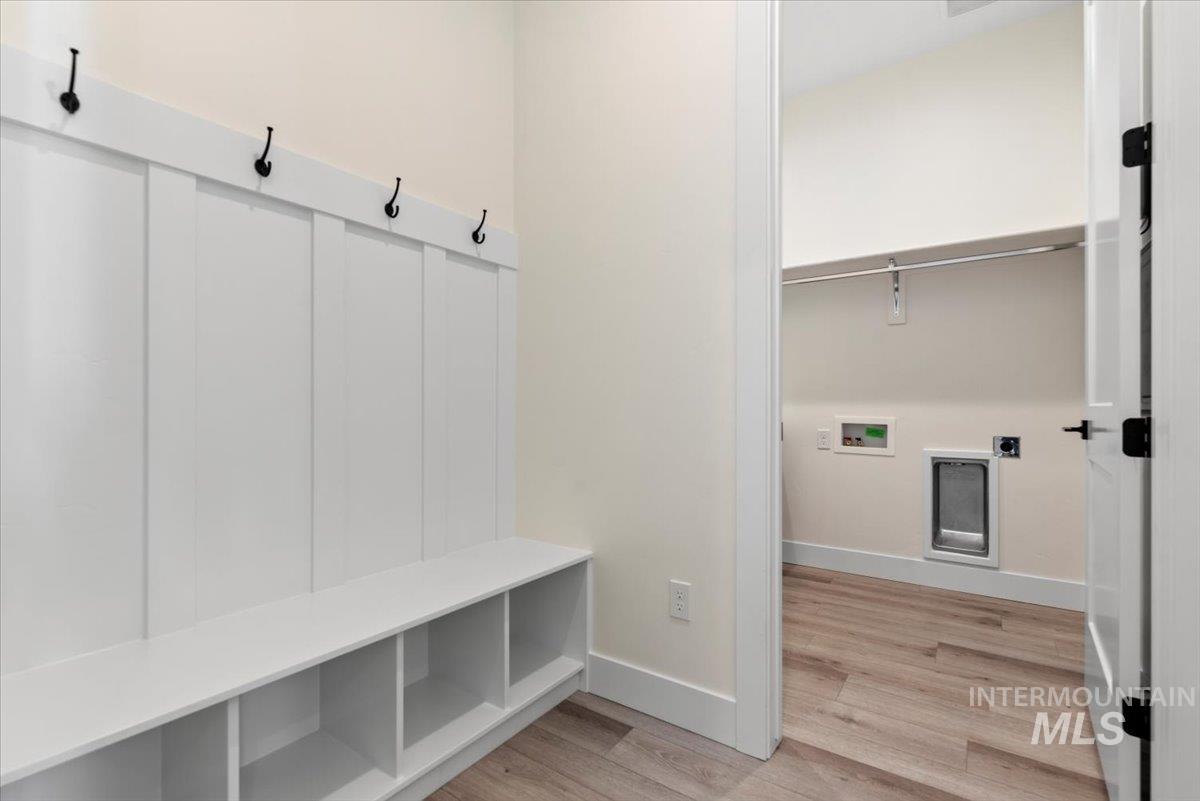 2391 East Snocreek Drive Eagle, ID 83616 - Photo 24 of 29 Mudroom featuring light wood finished floors and baseboards