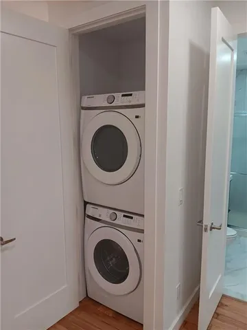 a view of a hallway with washer and dryer