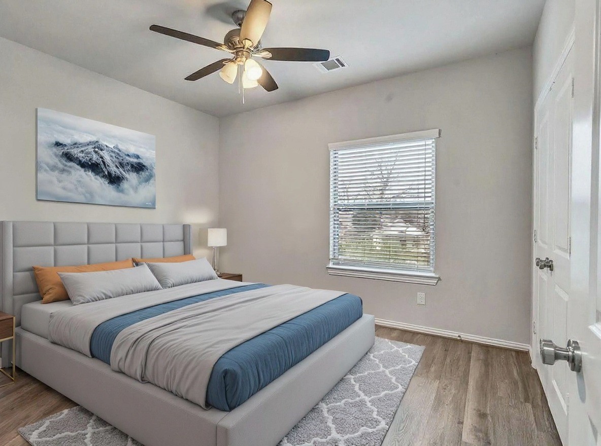 2411 Charles Road, Unit A Houston, TX 77093 - Photo 20 of 33 a bedroom with a large bed and a window