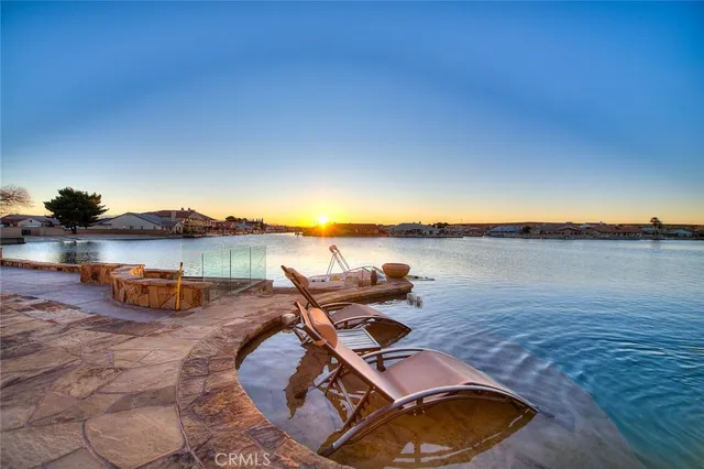 a view of swimming pool with a lake view