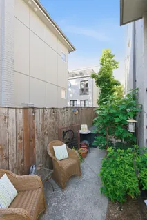 a outdoor living space with furniture and a potted plant