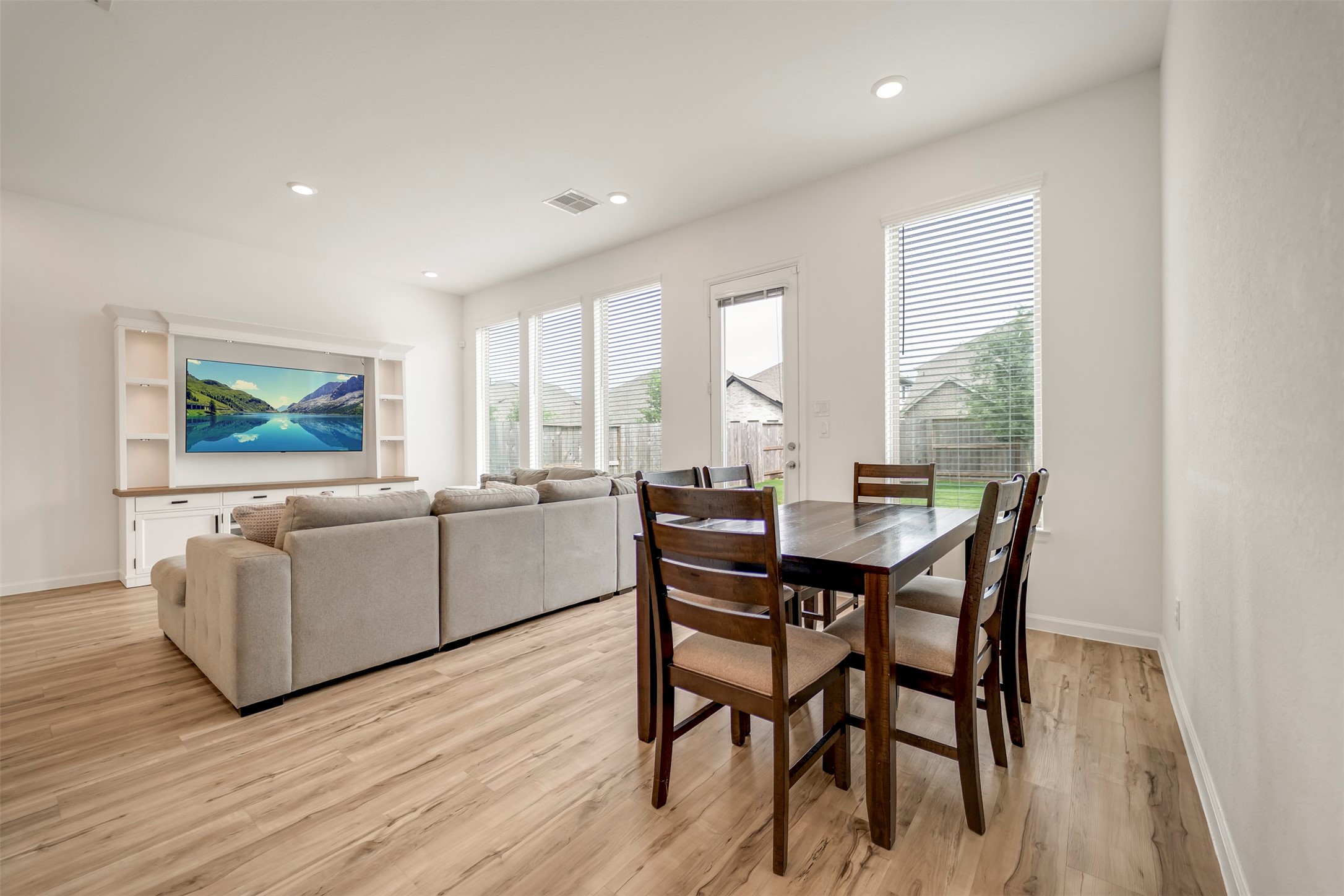 4127 Champlain Way Iowa Colony, TX 77583 - Photo 11 of 35 a dining room with furniture and wooden floor