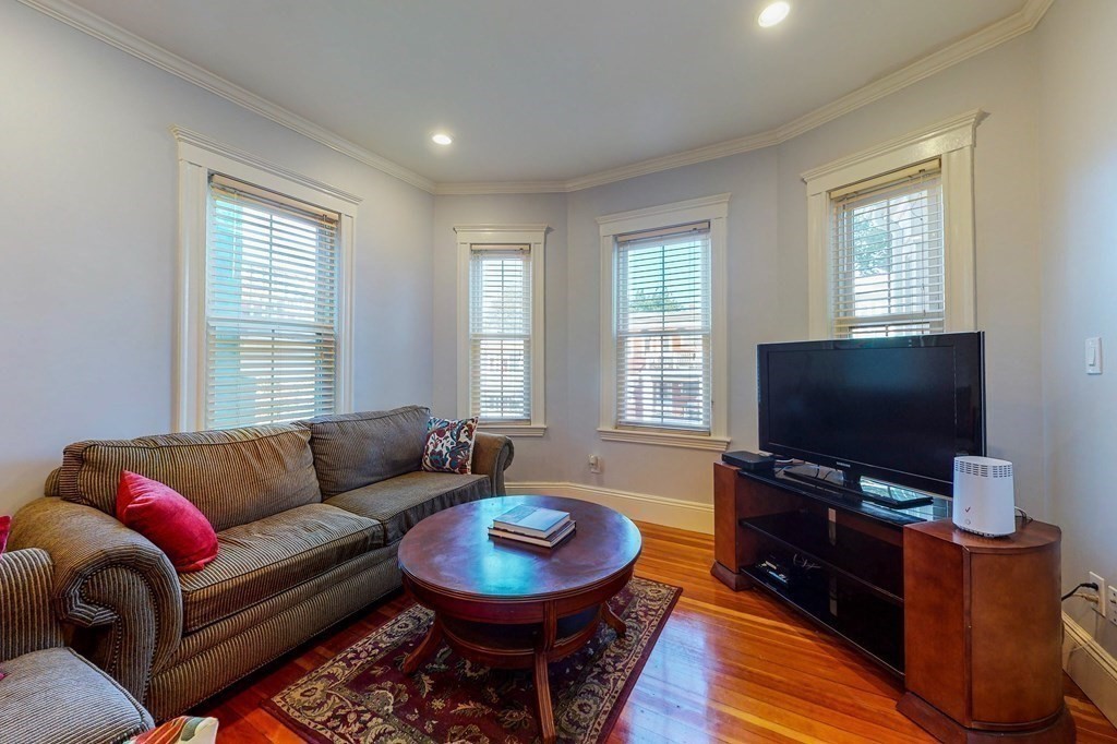 77 Montebello Road, Unit 2 Boston, MA 02130 - Photo 2 of 24 a living room with furniture and a flat screen tv