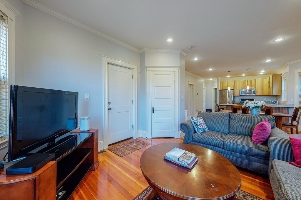 77 Montebello Road, Unit 2 Boston, MA 02130 - Photo 3 of 24 a living room with furniture and a flat screen tv