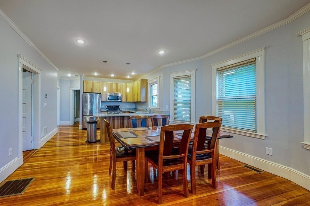 77 Montebello Road, Unit 2 Boston, MA 02130 - Photo 5 of 24 a view of a dining room with furniture and wooden floor