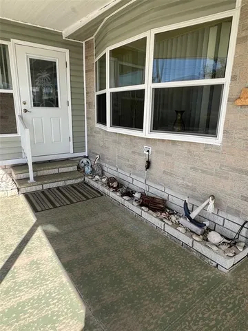 a room with a flat screen tv and a stove