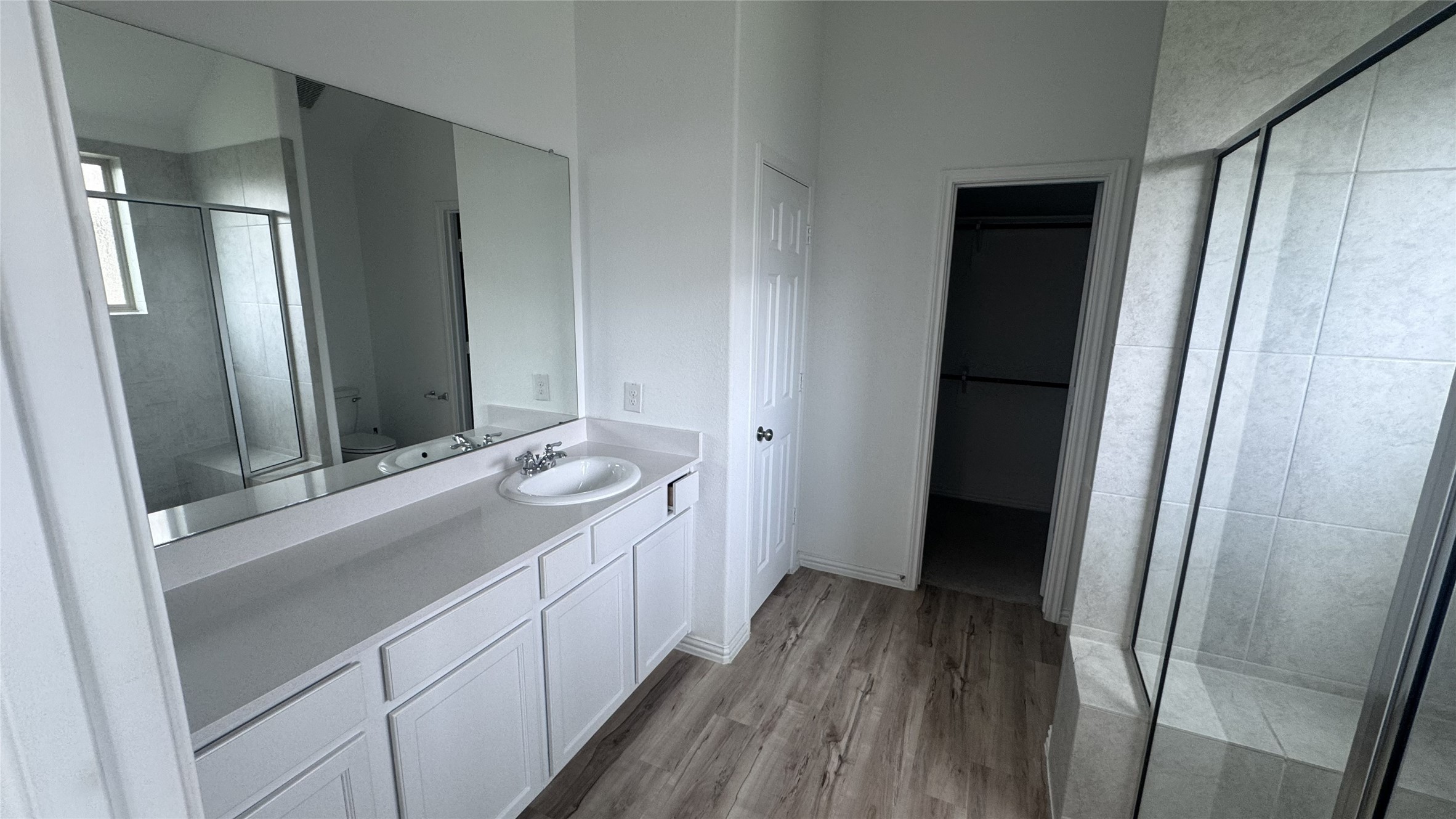 15746 Harding Bend Drive Humble, TX 77346 - Photo 7 of 18 a bathroom with a sink and a mirror