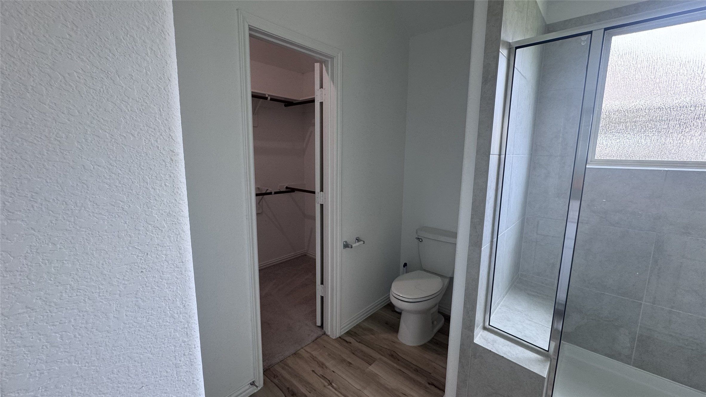15746 Harding Bend Drive Humble, TX 77346 - Photo 10 of 18 a bathroom with a toilet and a shower