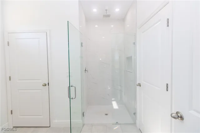 a bathroom with a toilet a sink and shower