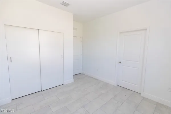 an empty room with a shower