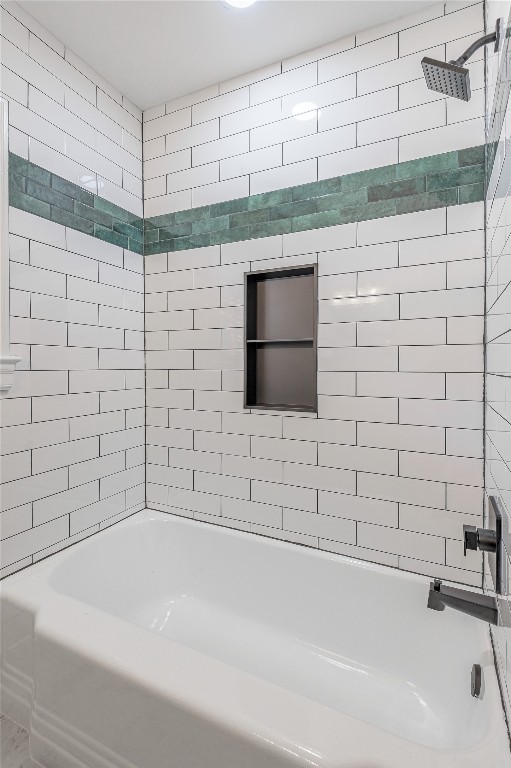 1415 22nd Street Huntsville, TX 77340 - Photo 17 of 30 a bathroom with a bathtub and shower