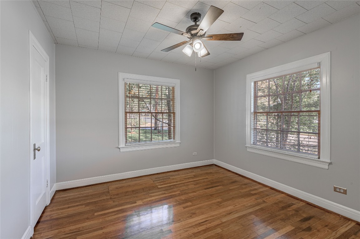 1415 22nd Street Huntsville, TX 77340 - Photo 18 of 30 a view of an empty room with wooden floor and a window