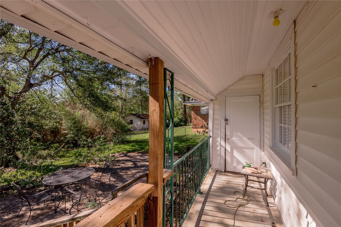 1415 22nd Street Huntsville, TX 77340 - Photo 24 of 30 a balcony view with wooden floor