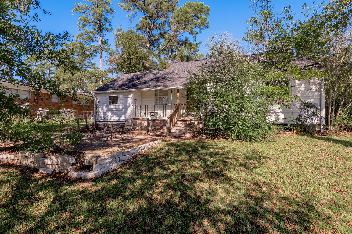 1415 22nd Street Huntsville, TX 77340 - Photo 28 of 30 a view of a house with a yard