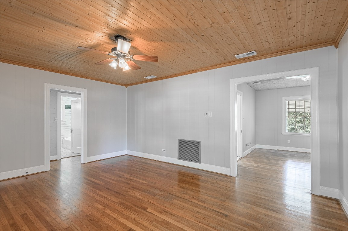 1415 22nd Street Huntsville, TX 77340 - Photo 6 of 30 a view of an empty room with window and wooden floor