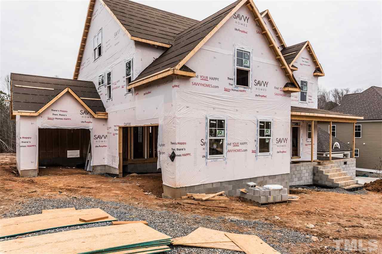 1117 Harrison Ridge Road Wake Forest, NC 27587 - Photo 2 of 6 a front view of a house with a yard