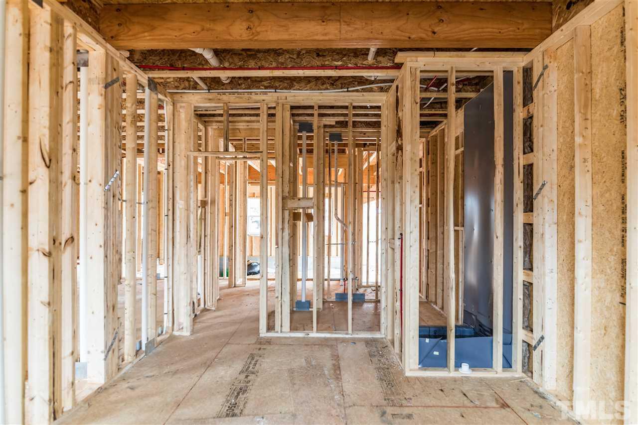 1117 Harrison Ridge Road Wake Forest, NC 27587 - Photo 6 of 6 a view of a balcony with wooden floor and door