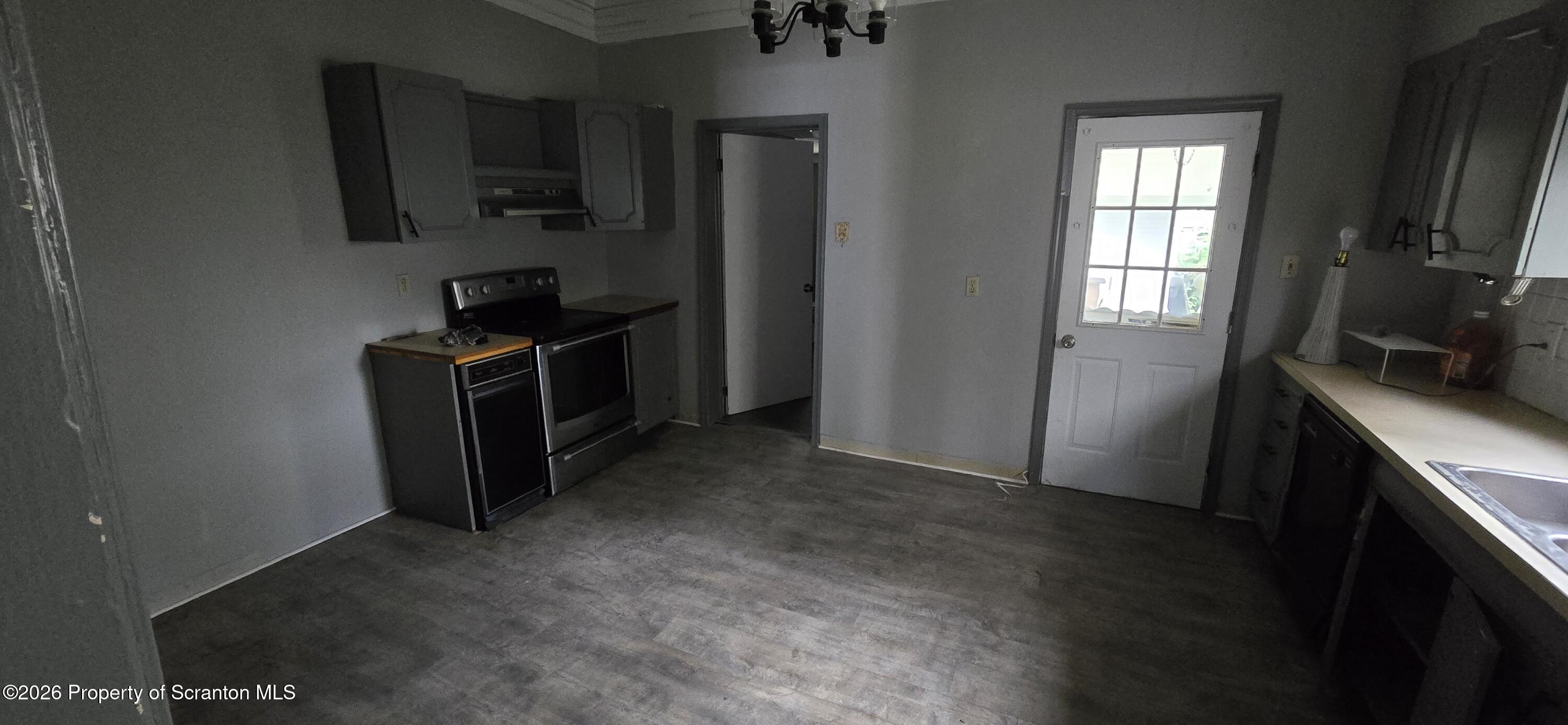 1140-1142 Academy Street Scranton, PA 18504 - Photo 11 of 49 a kitchen with a refrigerator stove and microwave