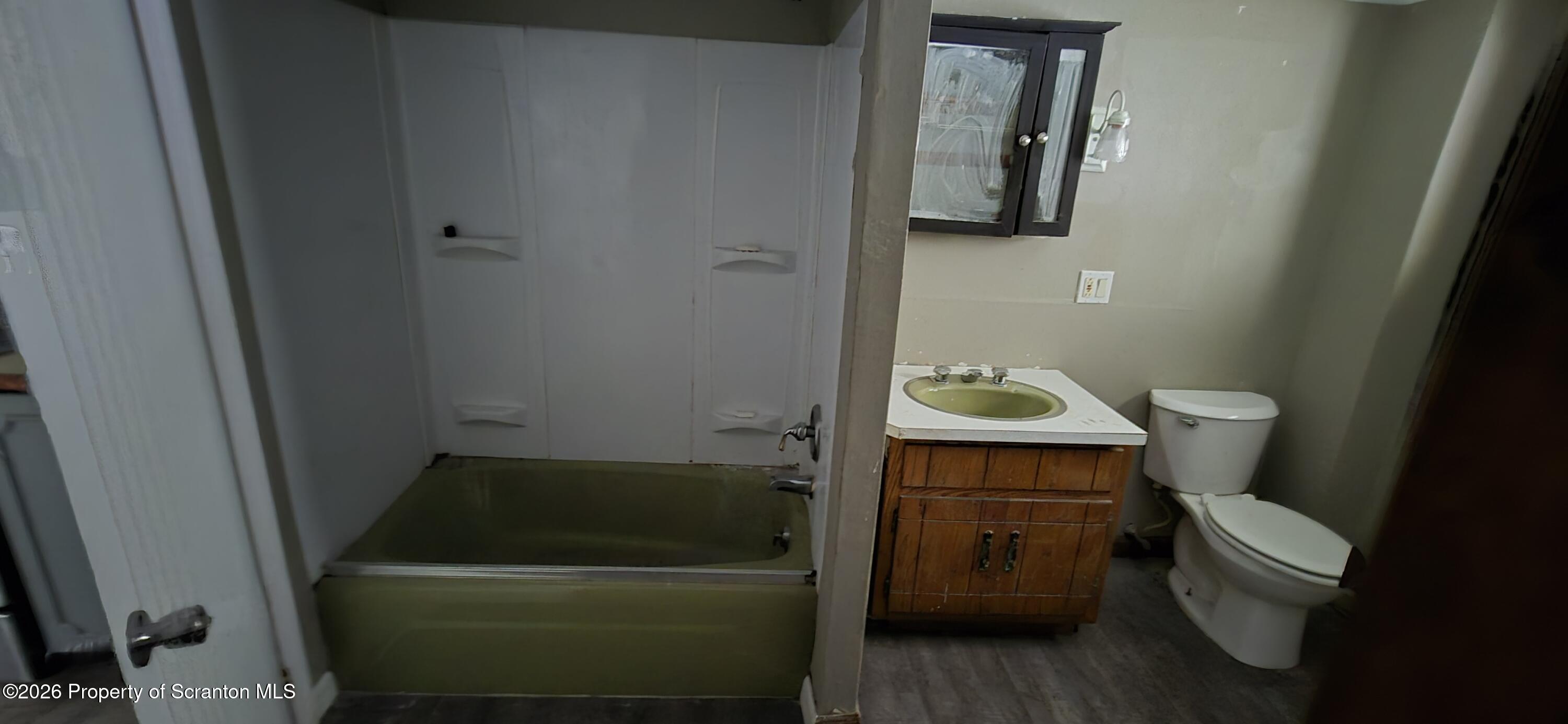 1140-1142 Academy Street Scranton, PA 18504 - Photo 14 of 49 a bathroom with a toilet and a sink