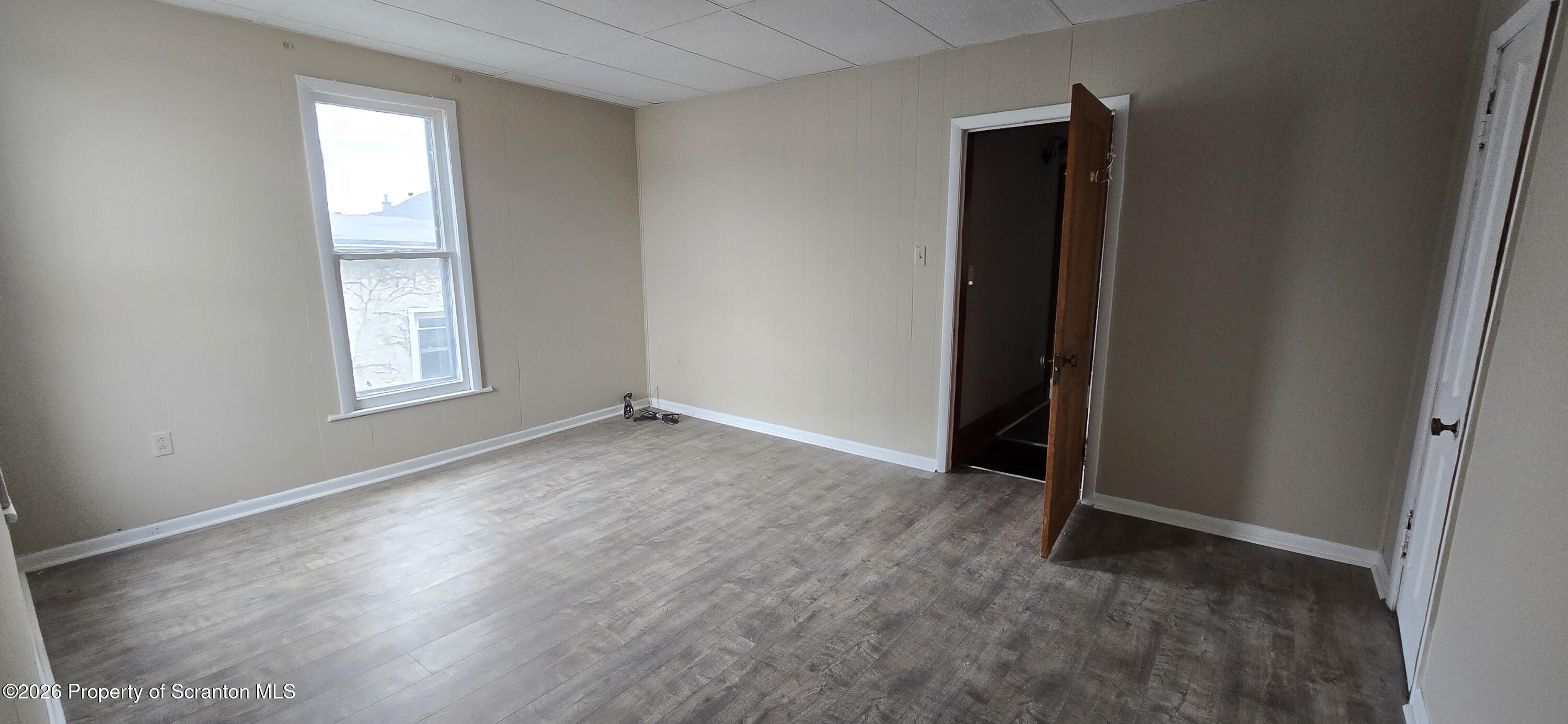 1140-1142 Academy Street Scranton, PA 18504 - Photo 22 of 49 an empty room that has a window in it