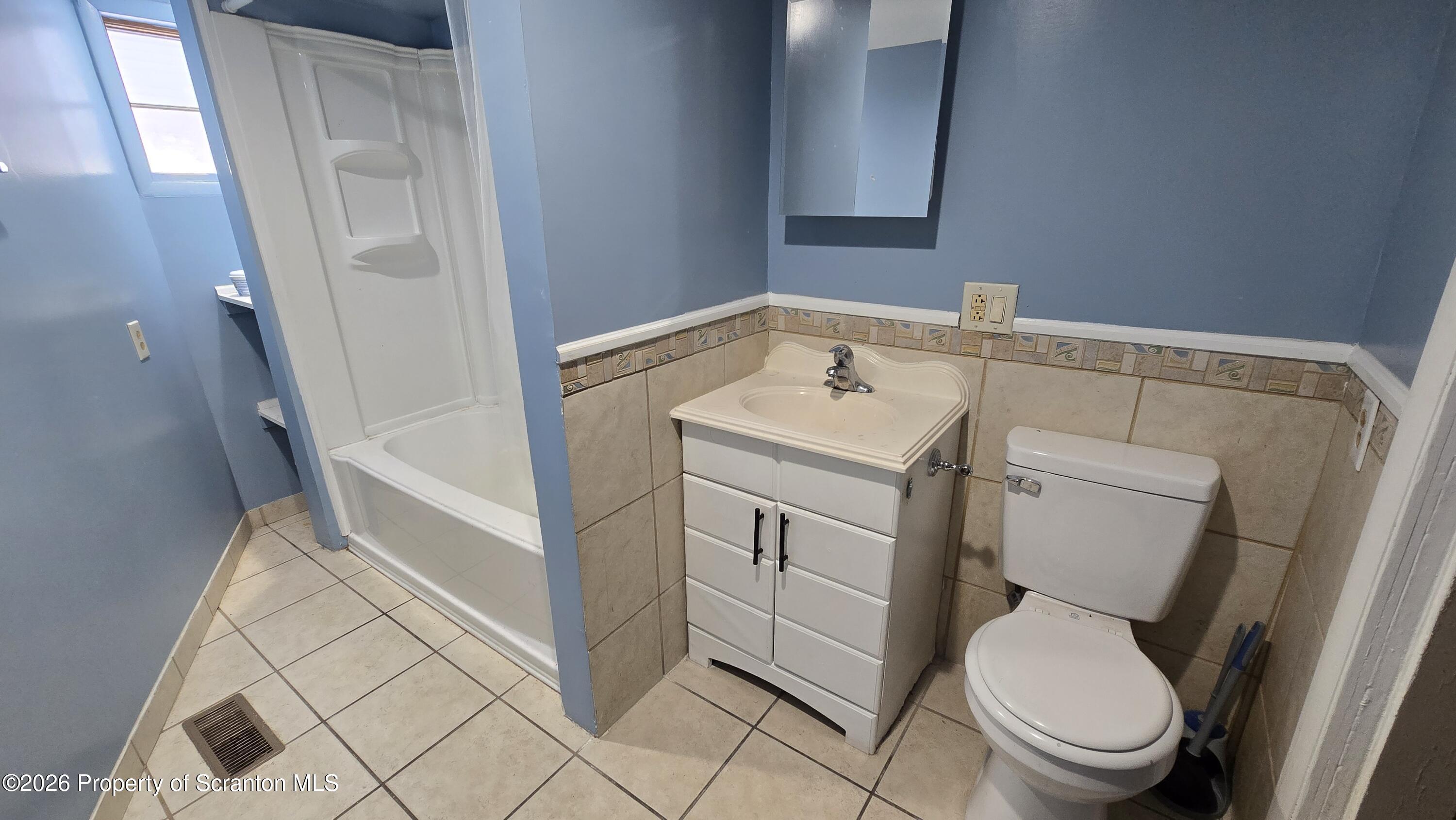 1140-1142 Academy Street Scranton, PA 18504 - Photo 31 of 49 a bathroom with a sink and a toilet