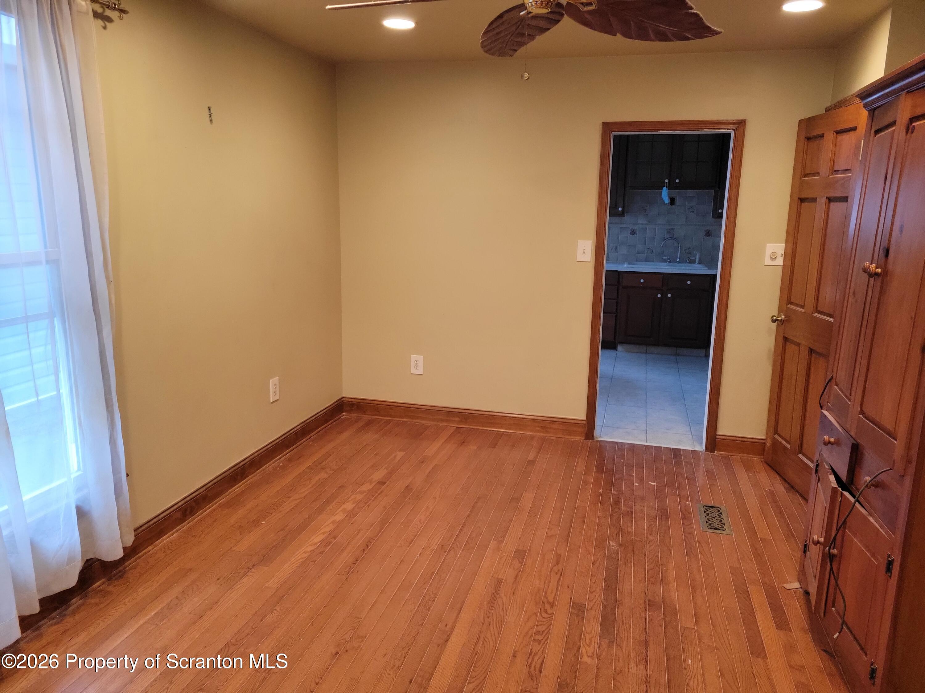 1140-1142 Academy Street Scranton, PA 18504 - Photo 38 of 49 an empty room with wooden floor and entrance