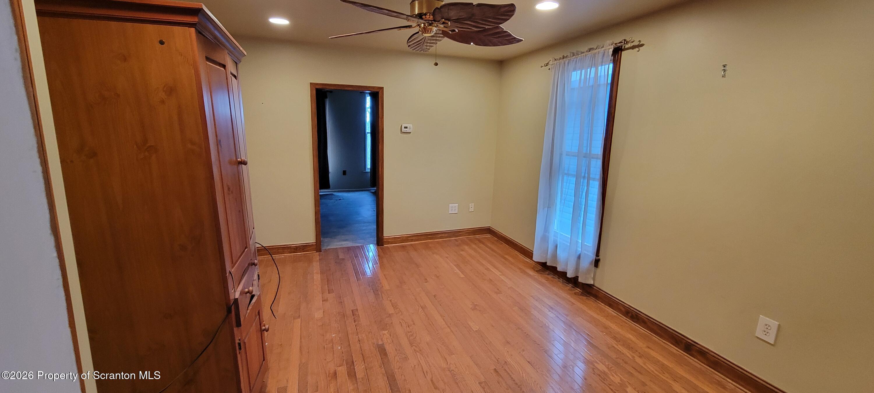 1140-1142 Academy Street Scranton, PA 18504 - Photo 40 of 49 a view of hallway with wooden floor