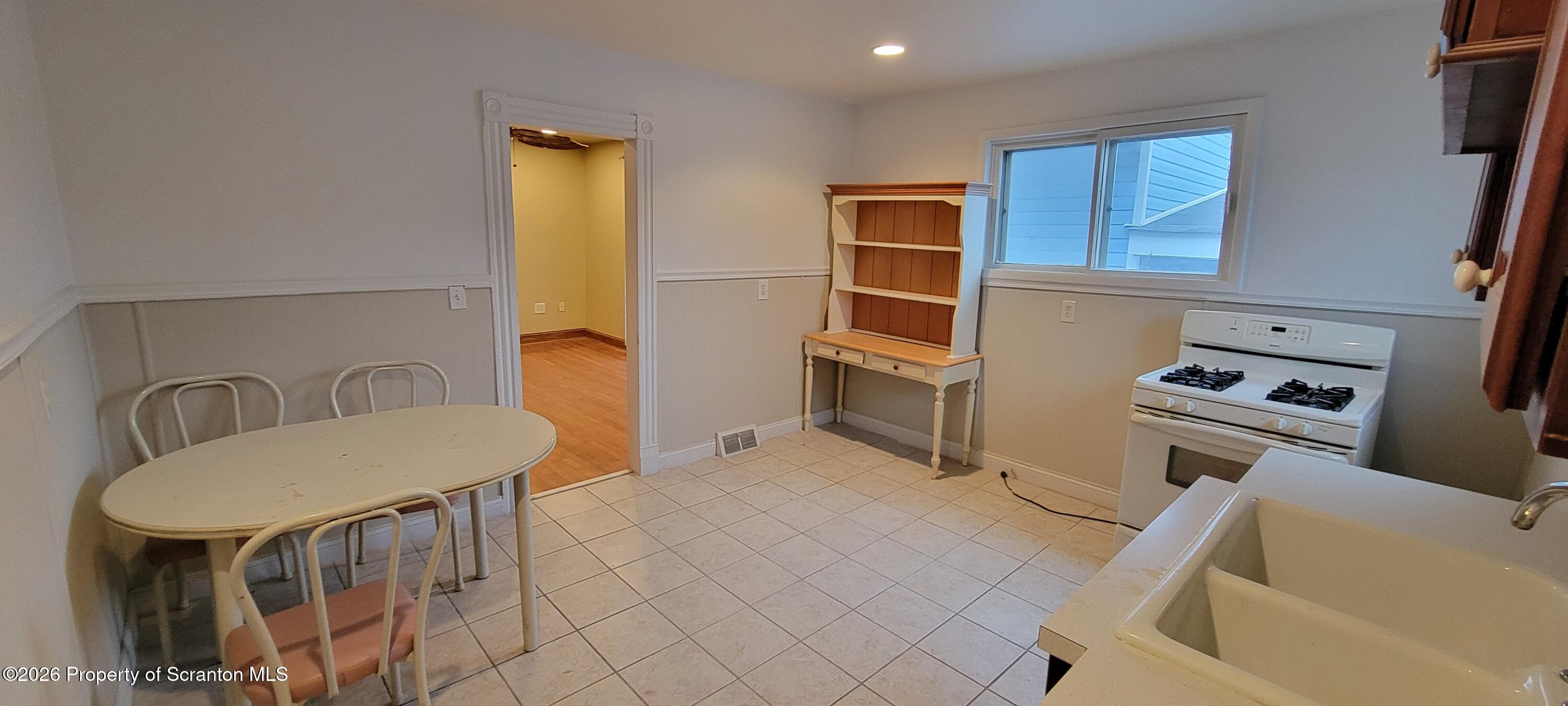 1140-1142 Academy Street Scranton, PA 18504 - Photo 45 of 49 a bathroom with a tub sink and mirror