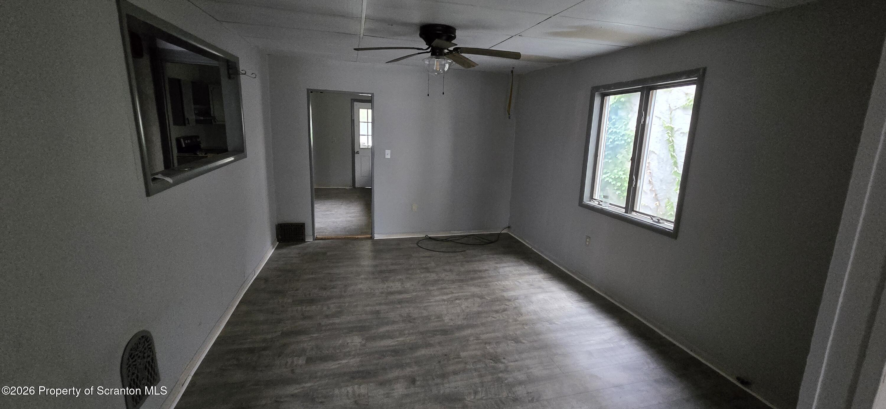 1140-1142 Academy Street Scranton, PA 18504 - Photo 8 of 49 wooden floor in an empty room with a window