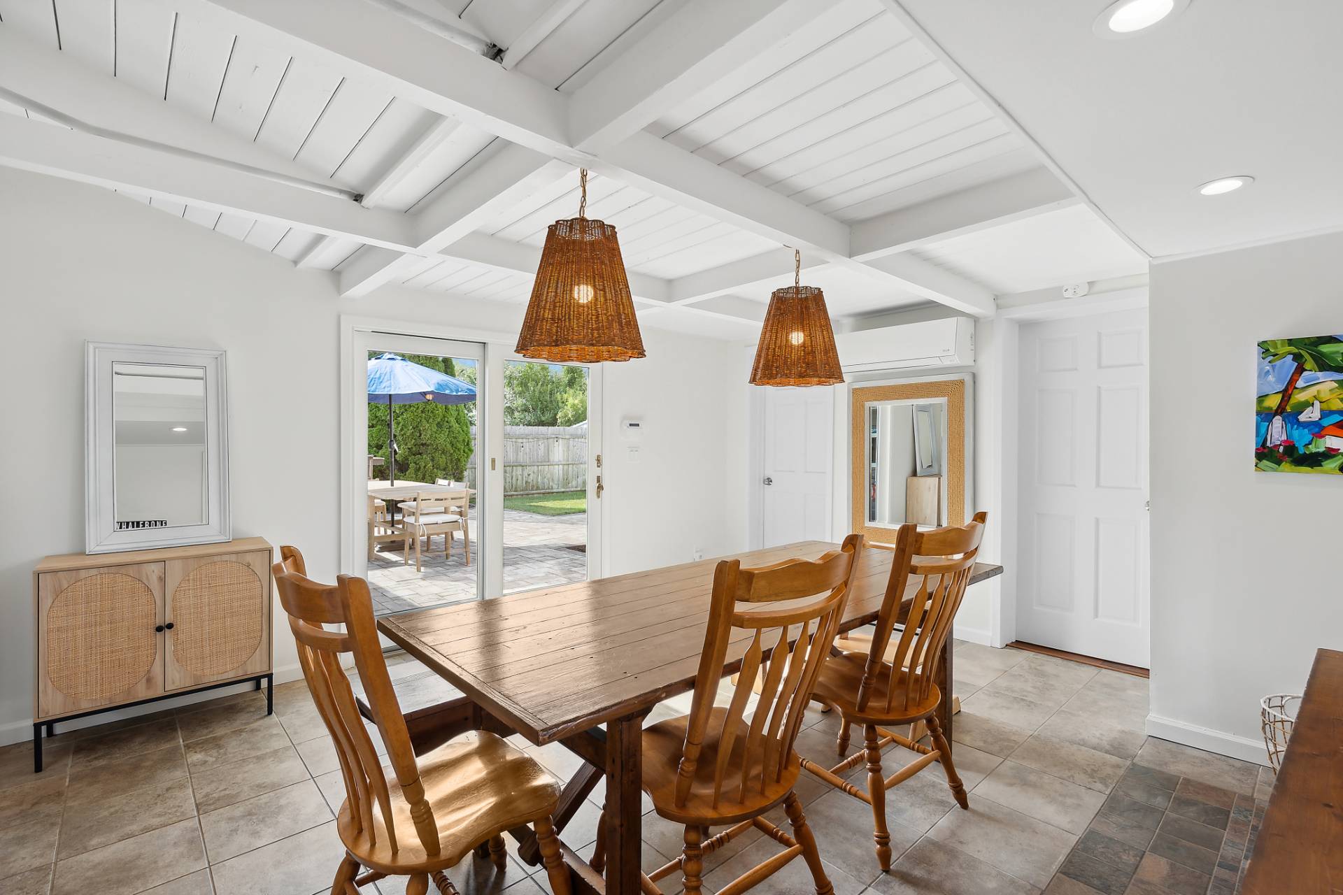 1 Shadbush Road Montauk, NY 11954 - Photo 7 of 19 a view of a dining room with furniture and chandelier