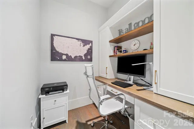 a view of a workspace with furniture