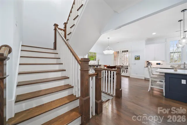 a view of entryway and hall with wooden floor