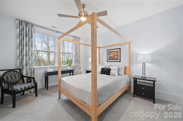 a bed room with a bed and a couch