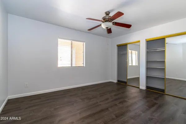a view of an empty room with glass door