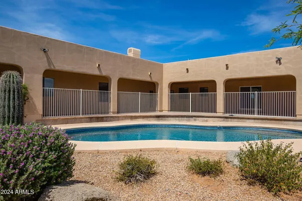a front view of a house with swimming pool