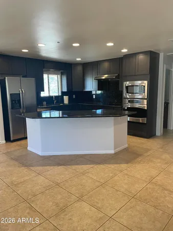 a kitchen with a stove and a microwave