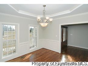 Lot 12 Booth Pond Road Raeford, NC 28376 - Photo 2 of 11 a view of a room with wooden floor and large windows