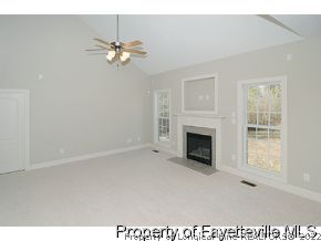 Lot 12 Booth Pond Road Raeford, NC 28376 - Photo 3 of 11 a view of a livingroom with a fireplace and window
