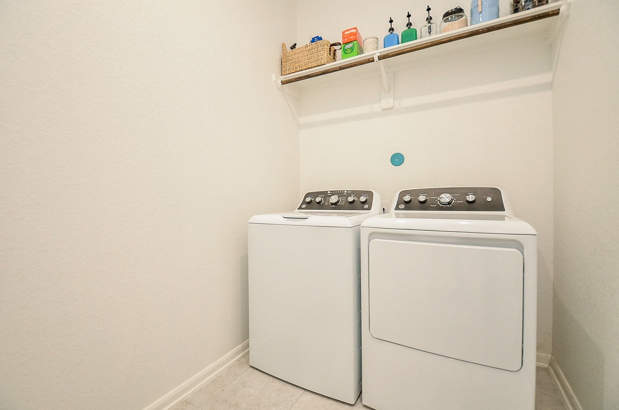5146 Prairie Terrace Lane Fulshear, TX 77441 - Photo 20 of 26 The laundry room is also located on the first floor for efficiency