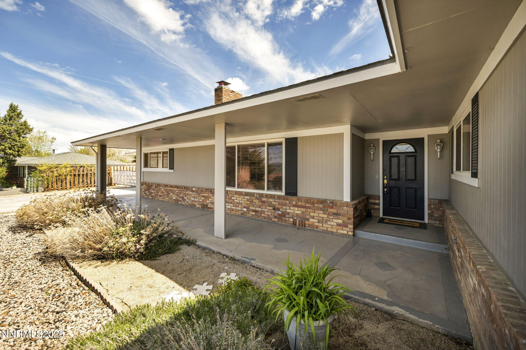 14190 Rim Rock Drive Reno, NV 89521 - Photo 5 of 68 a front view of a house with a yard