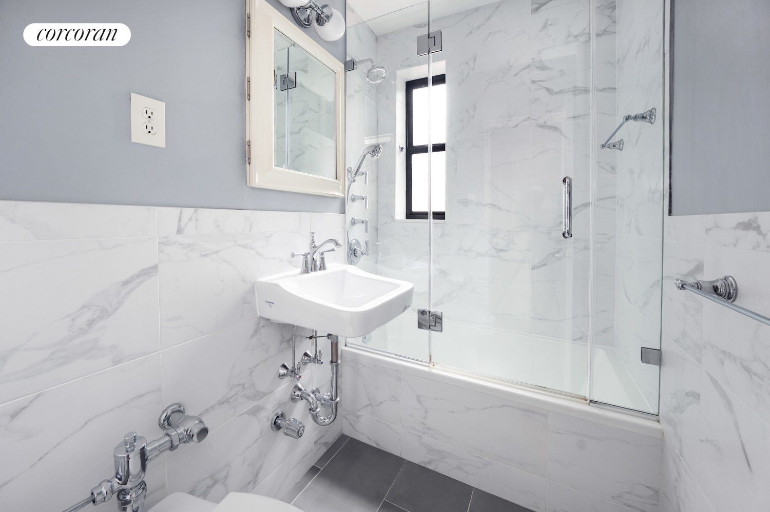 330 East 70th Street, Unit 5G Manhattan, NY 10021 - Photo 5 of 17 a bathroom with a sink a toilet and shower