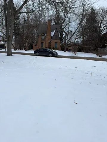 a view of a covered with snow in the yard