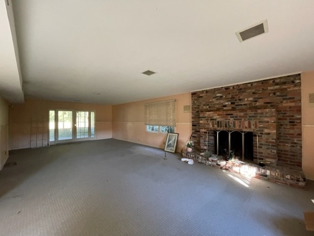 809 George W Towns Road Talbotton, GA 31827 - Photo 16 of 23 an empty room with fireplace and windows