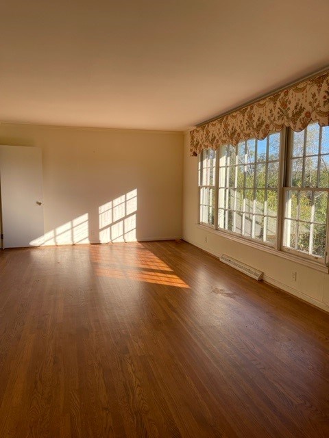 809 George W Towns Road Talbotton, GA 31827 - Photo 3 of 23 an empty room with wooden floor and windows