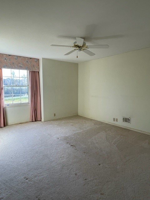809 George W Towns Road Talbotton, GA 31827 - Photo 9 of 23 an empty room with windows and ceiling fan