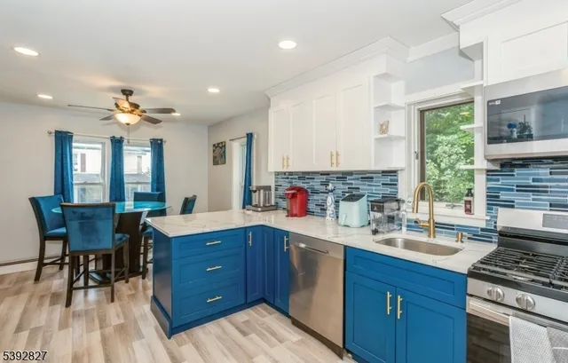 a kitchen with a sink stove and cabinets