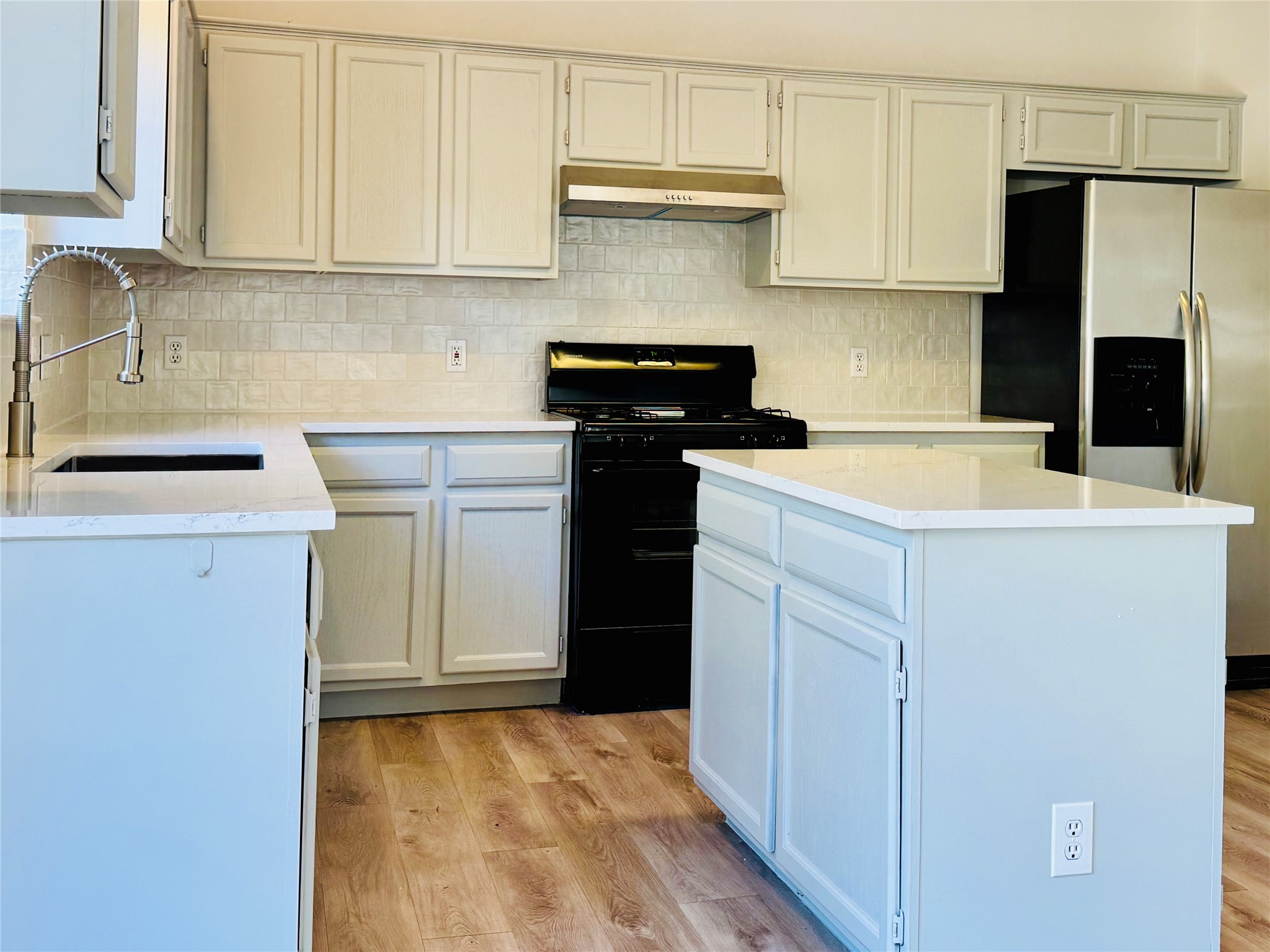 2113 Lobelia Drive Cedar Park, TX 78613 - Photo 12 of 38 a kitchen with a sink and cabinets