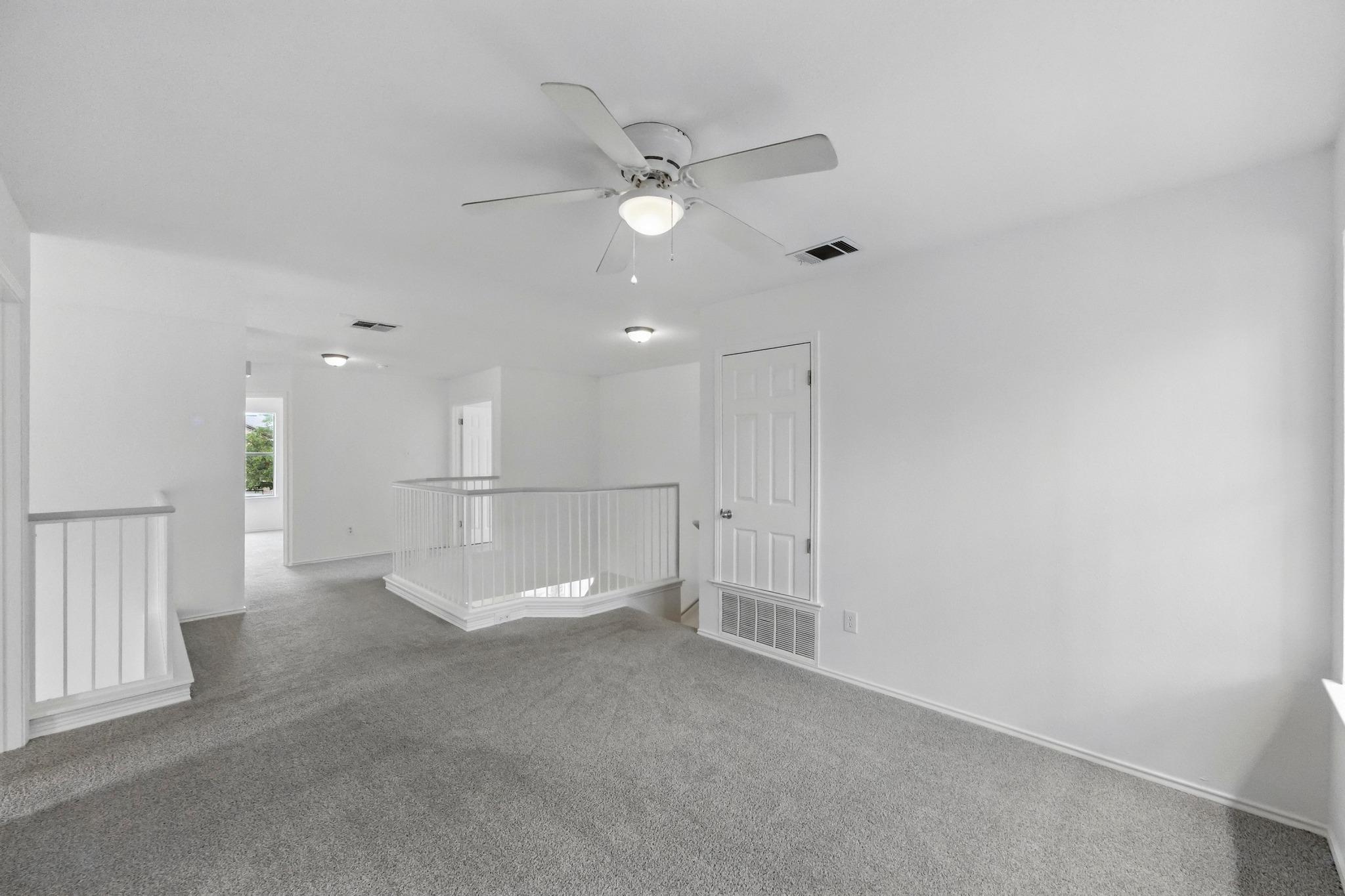 2113 Lobelia Drive Cedar Park, TX 78613 - Photo 22 of 38 a view of an empty room with a ceiling fan