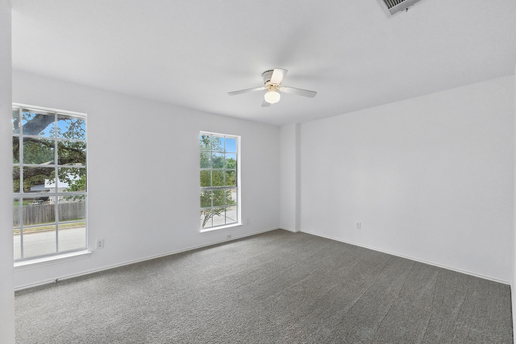 2113 Lobelia Drive Cedar Park, TX 78613 - Photo 23 of 38 an empty room with a window and a ceiling fan