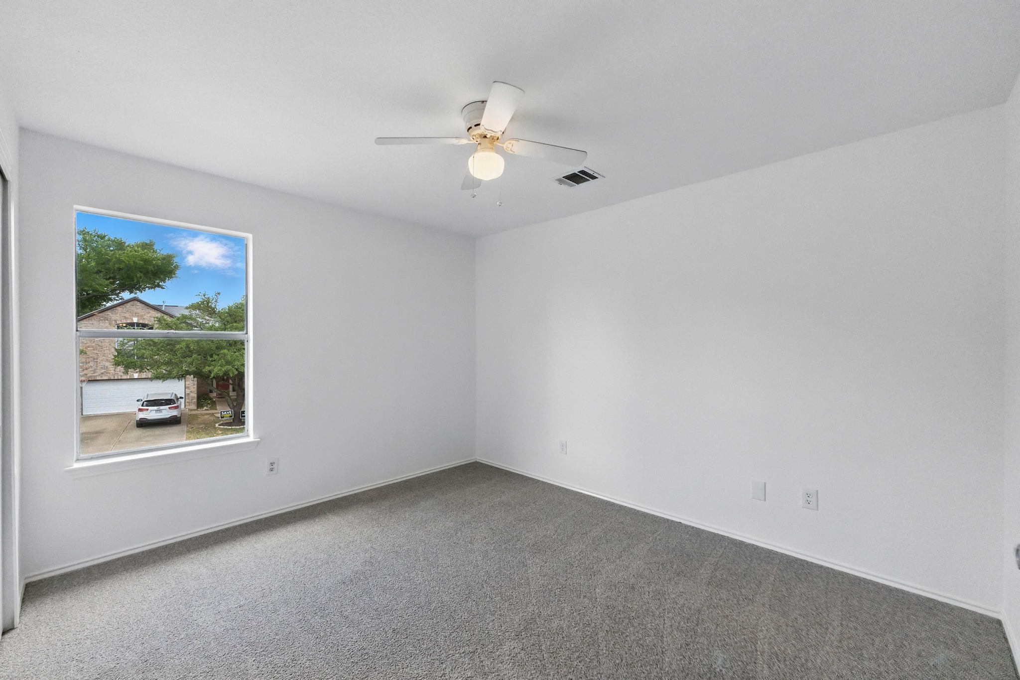 2113 Lobelia Drive Cedar Park, TX 78613 - Photo 25 of 38 an empty room with a window and a ceiling fan
